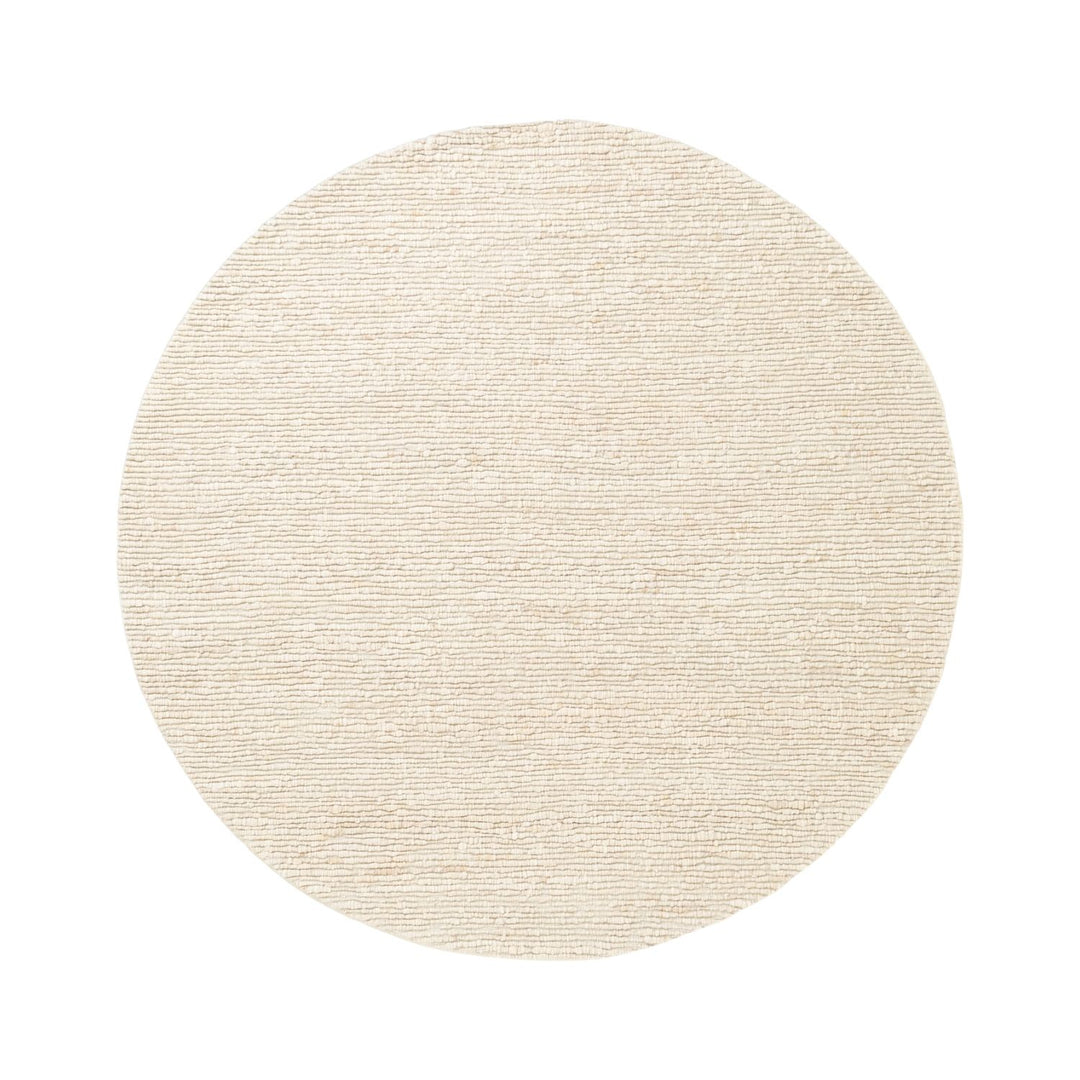 Round beige rug on a white background
