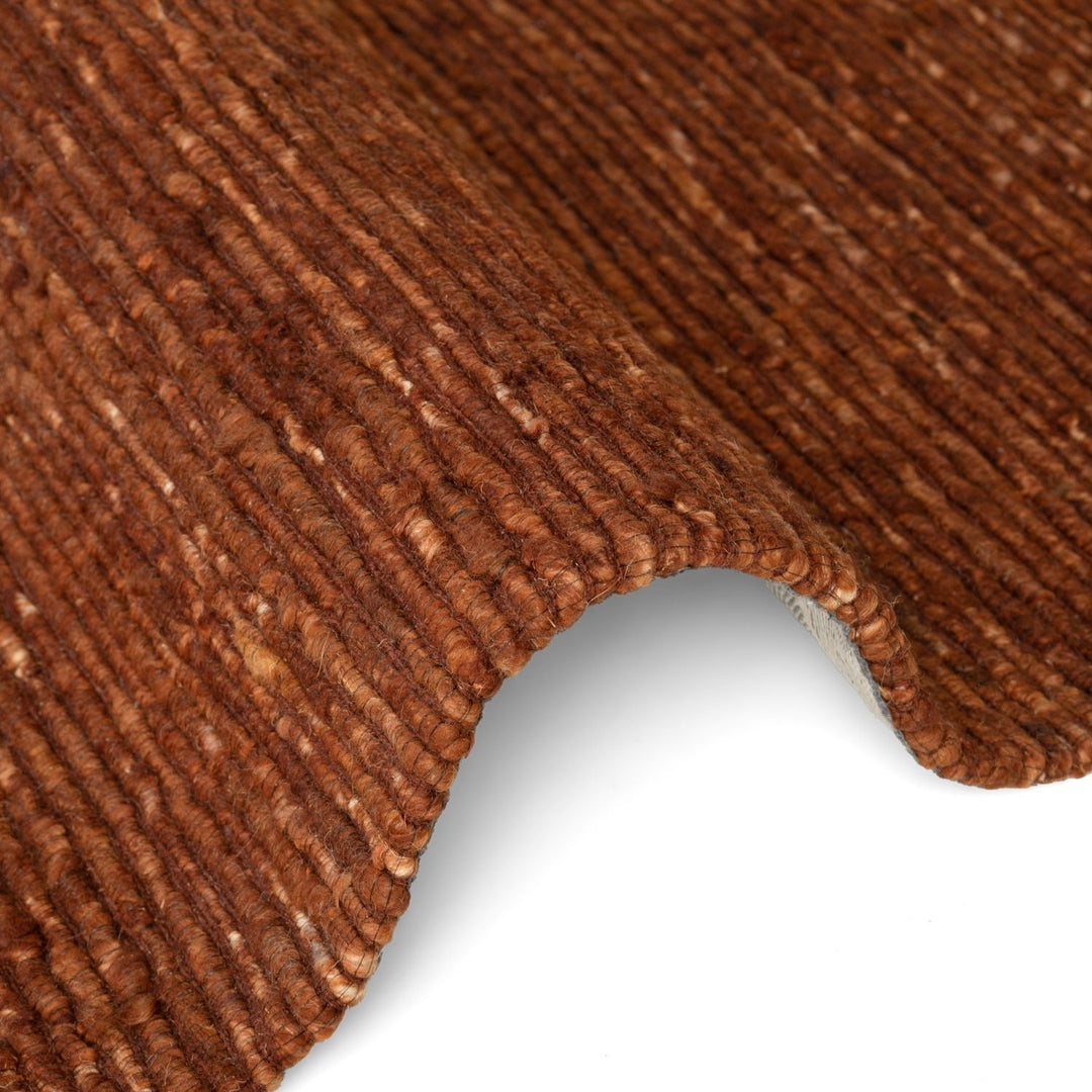 Close-up of brown textured fabric on a white background
