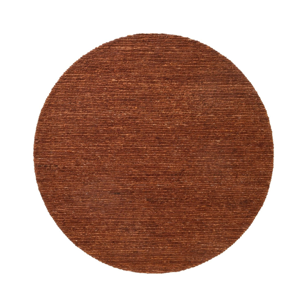 Round brown rug on a white background