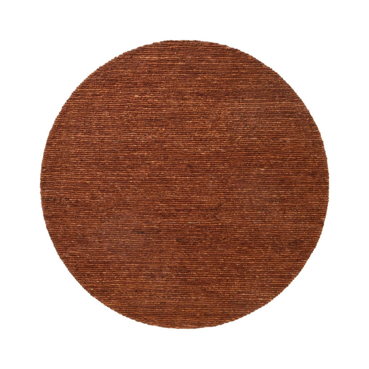 Round brown rug on a white background