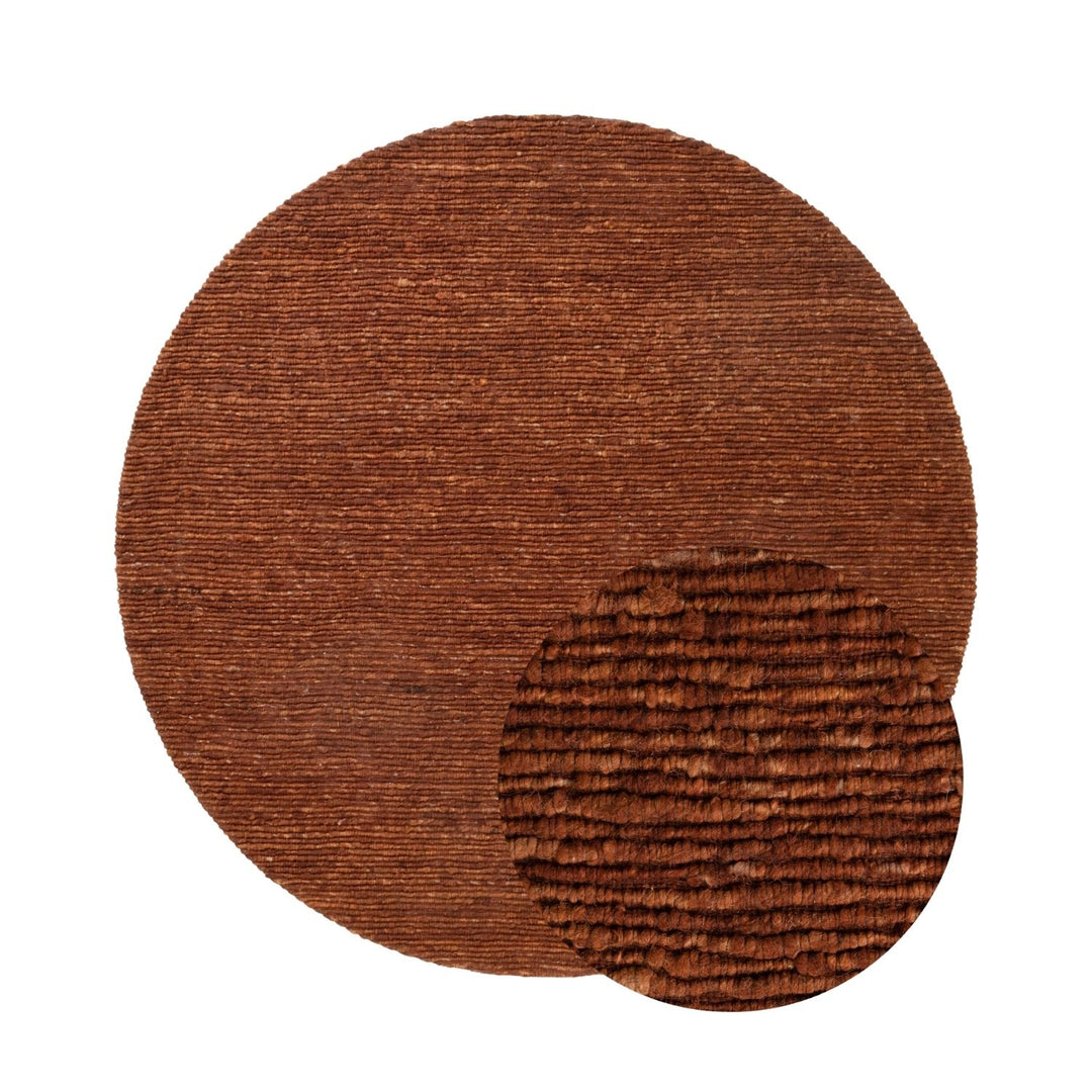 Brown textured circular rug on a white background