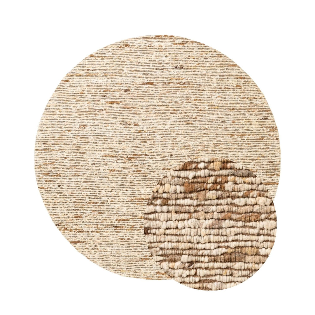 Round beige rug with a textured pattern on a white background