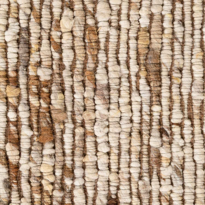 Close-up of textured beige and brown carpet