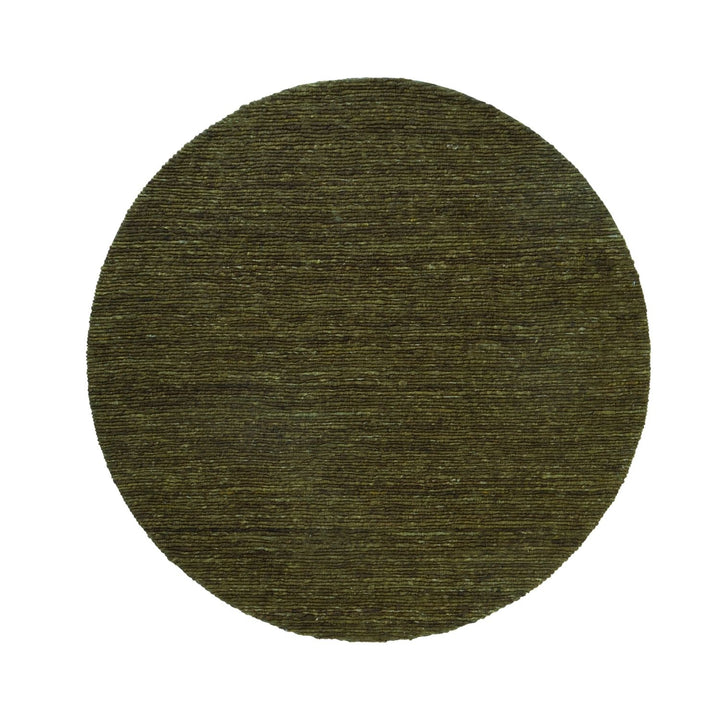 Round green rug on a white background