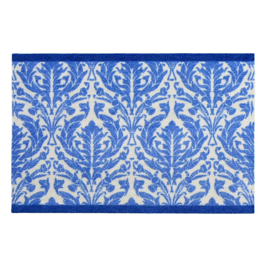 Blue and white patterned rug on a white background