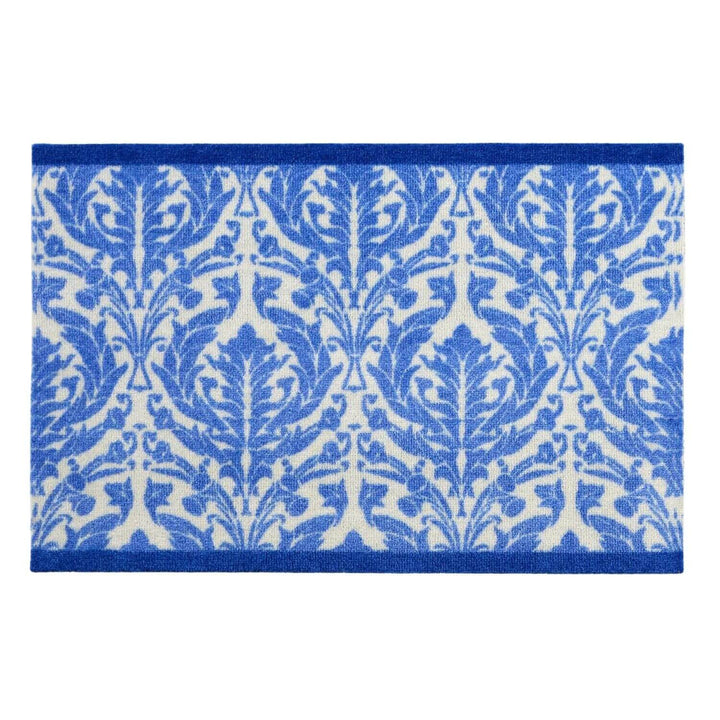Blue and white patterned rug on a white background
