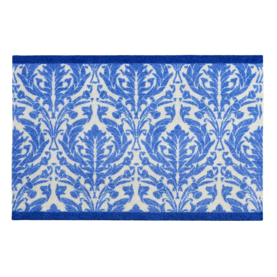 Blue and white patterned rug on a white background
