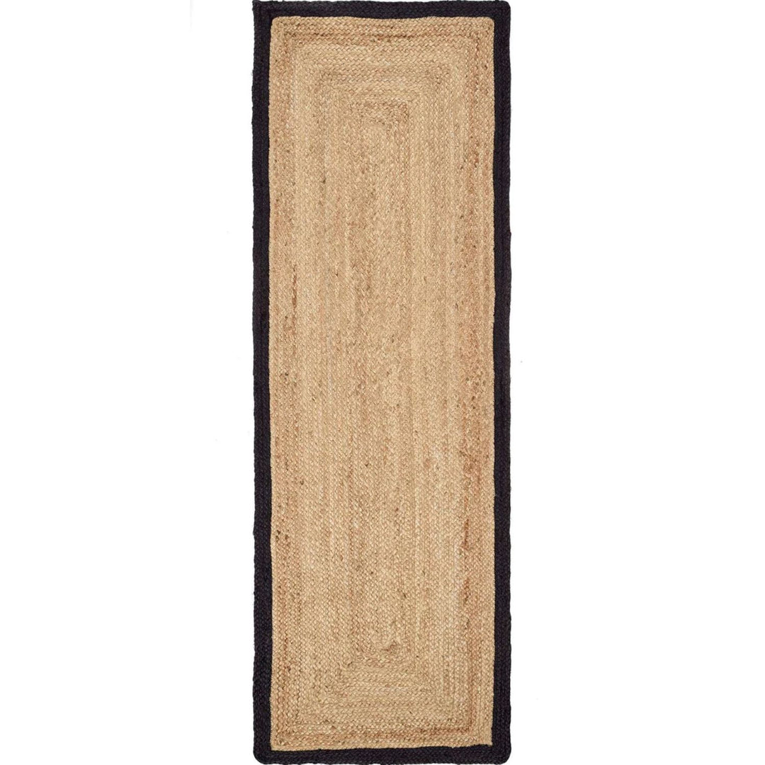Beige jute rug with black border on a white background