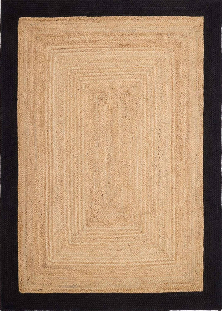 Beige braided rug on a black background