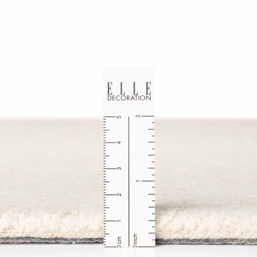 Fine Boucle Wool Rug Knots Natural White sound-absorbing, durable pile.