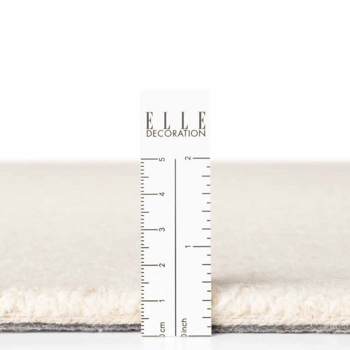 Fine Boucle Wool Rug Knots Natural White sound-absorbing, durable pile.