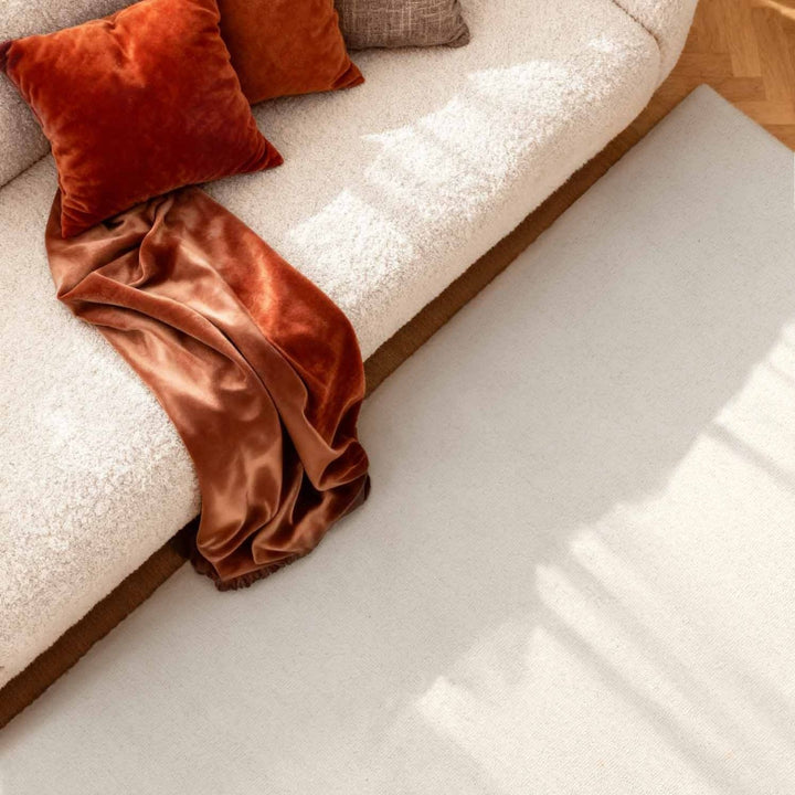 Fine Boucle Wool Rug Knots Natural White sound-absorbing, durable pile.