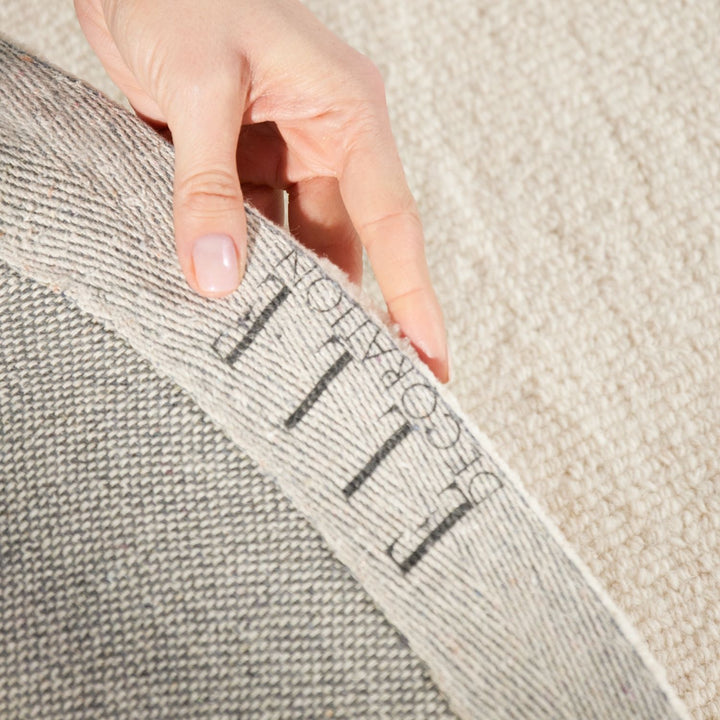 Fine Boucle Wool Rug Knots Natural White sound-absorbing, durable pile.