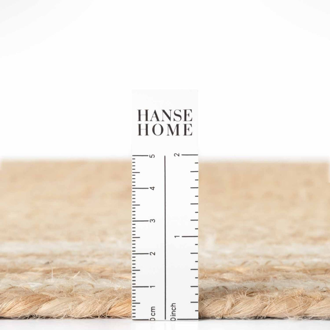 Textured beige fabric with a ruler for scale and 'HANSE HOME' branding.