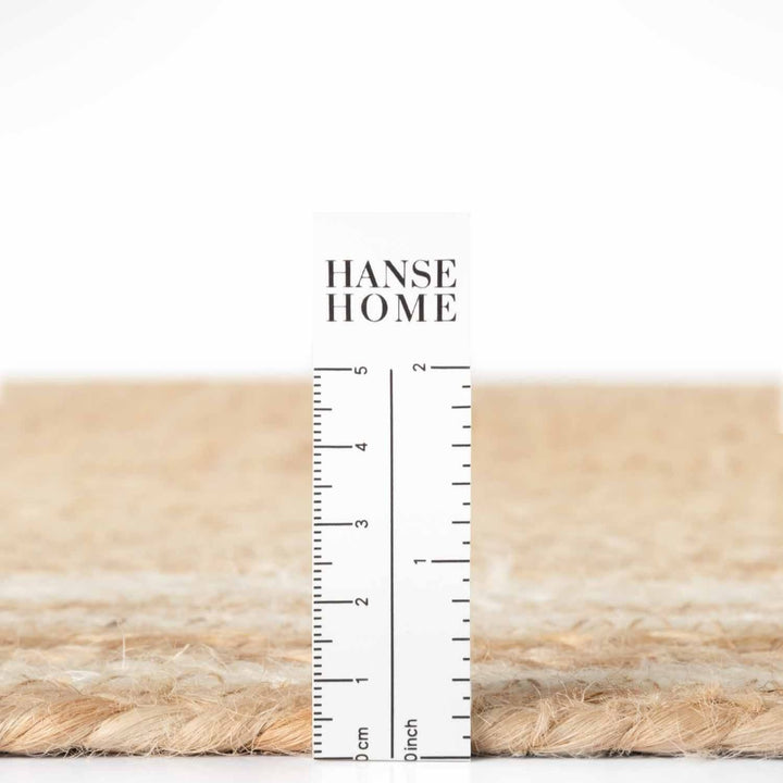 Textured beige fabric with a ruler for scale and 'HANSE HOME' branding.