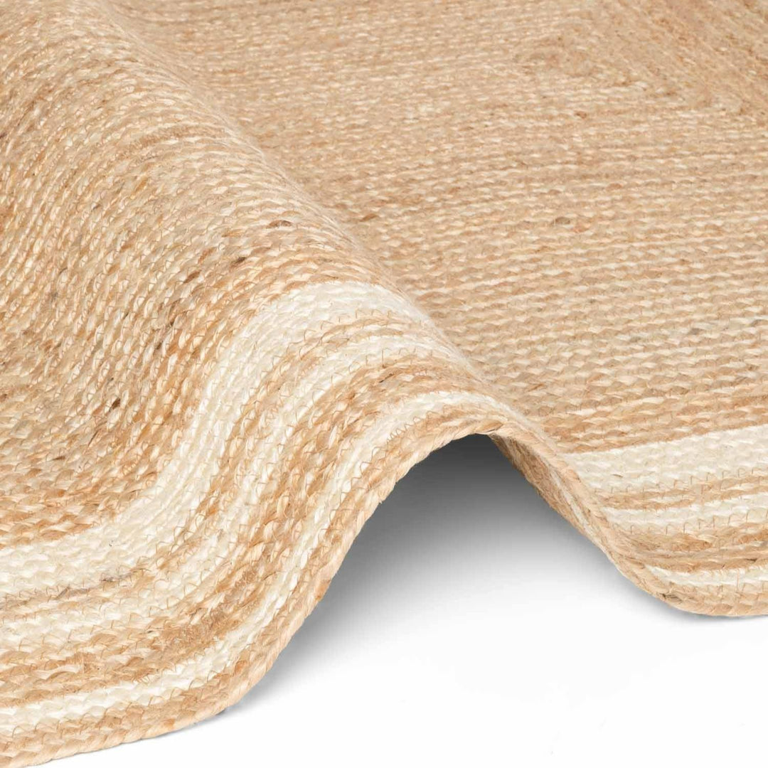 Close-up of beige textured fabric with a slight sheen on a white background