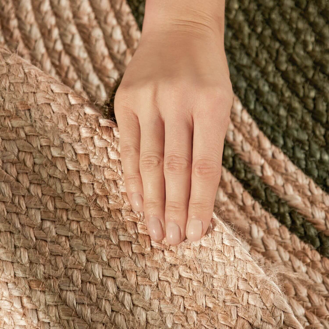 Hand touching a woven textured surface