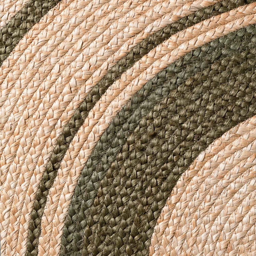 Close-up of braided rope with beige and green pattern