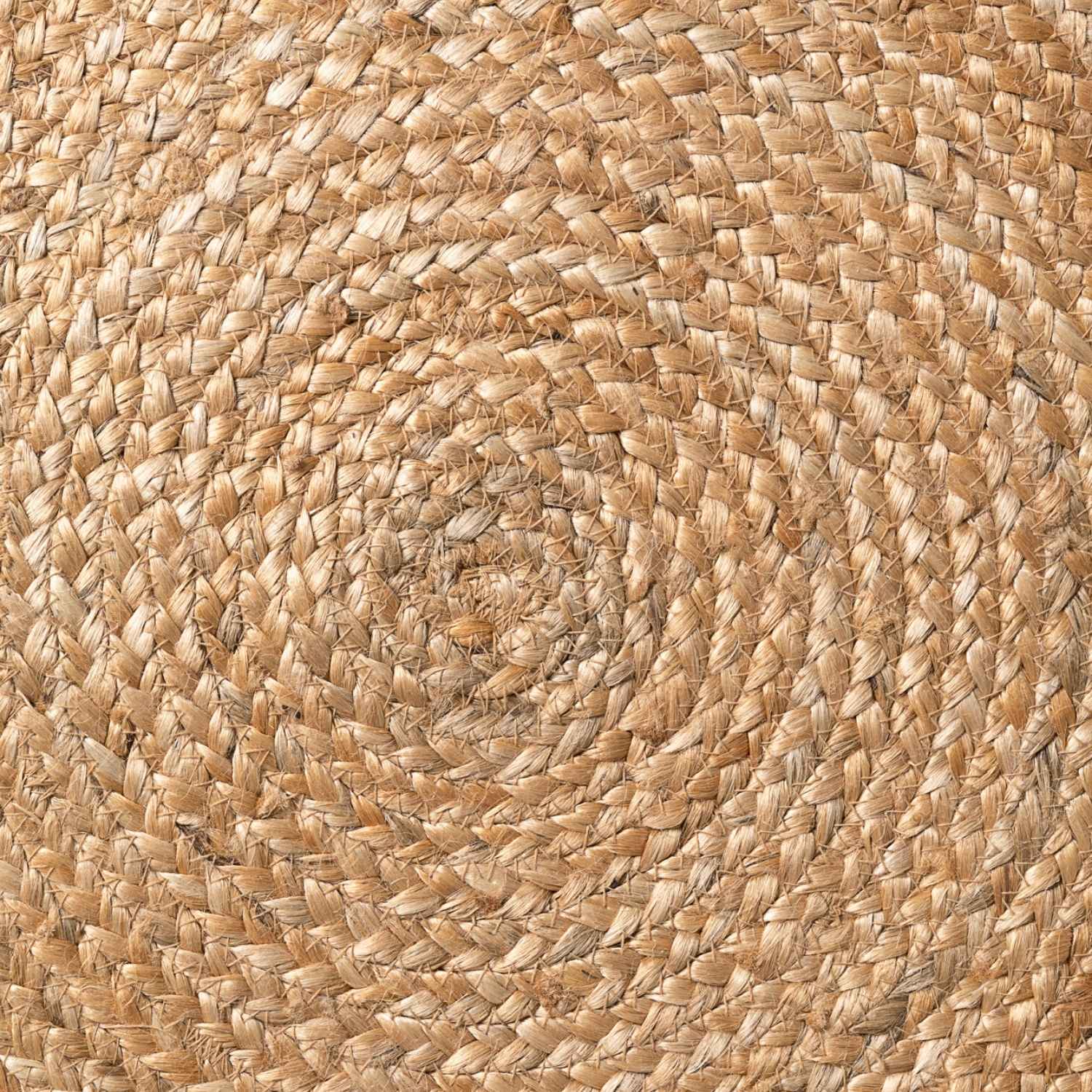 Close-up of a woven jute mat with a natural brown color.