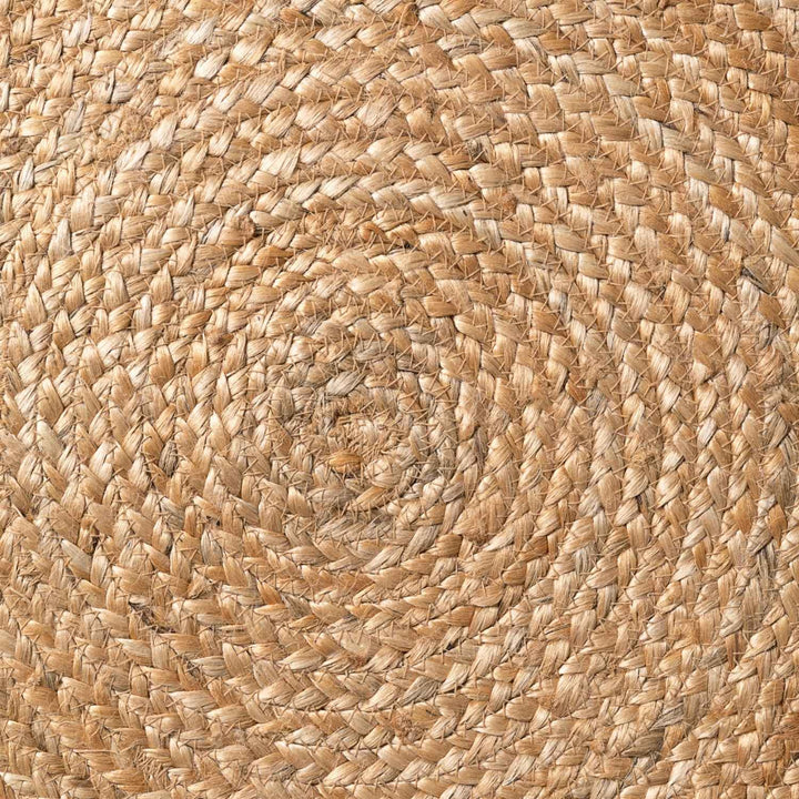 Close-up of a woven jute mat with a natural brown color.