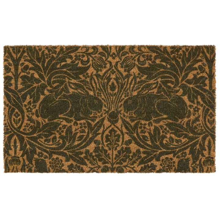 Decorative doormat with intricate black pattern on a brown background