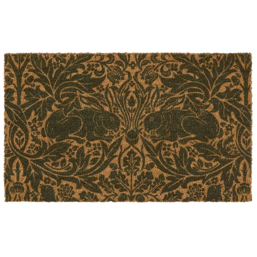 Decorative doormat with intricate black pattern on a brown background