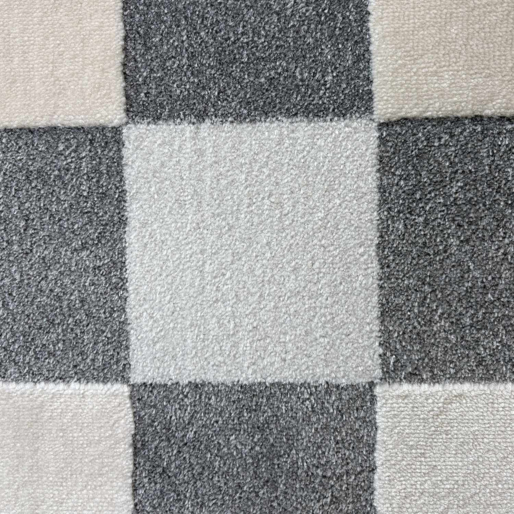 Close-up of a checkered pattern with alternating black and gray squares.