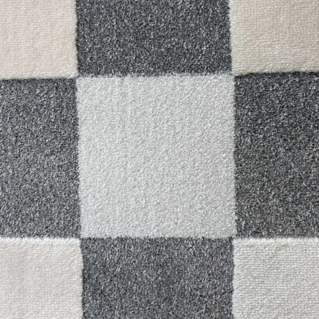 Close-up of a checkered pattern with alternating black and gray squares.