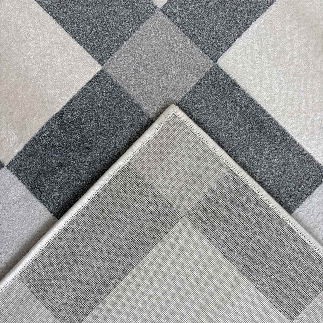 Gray and white checkered patterned rug