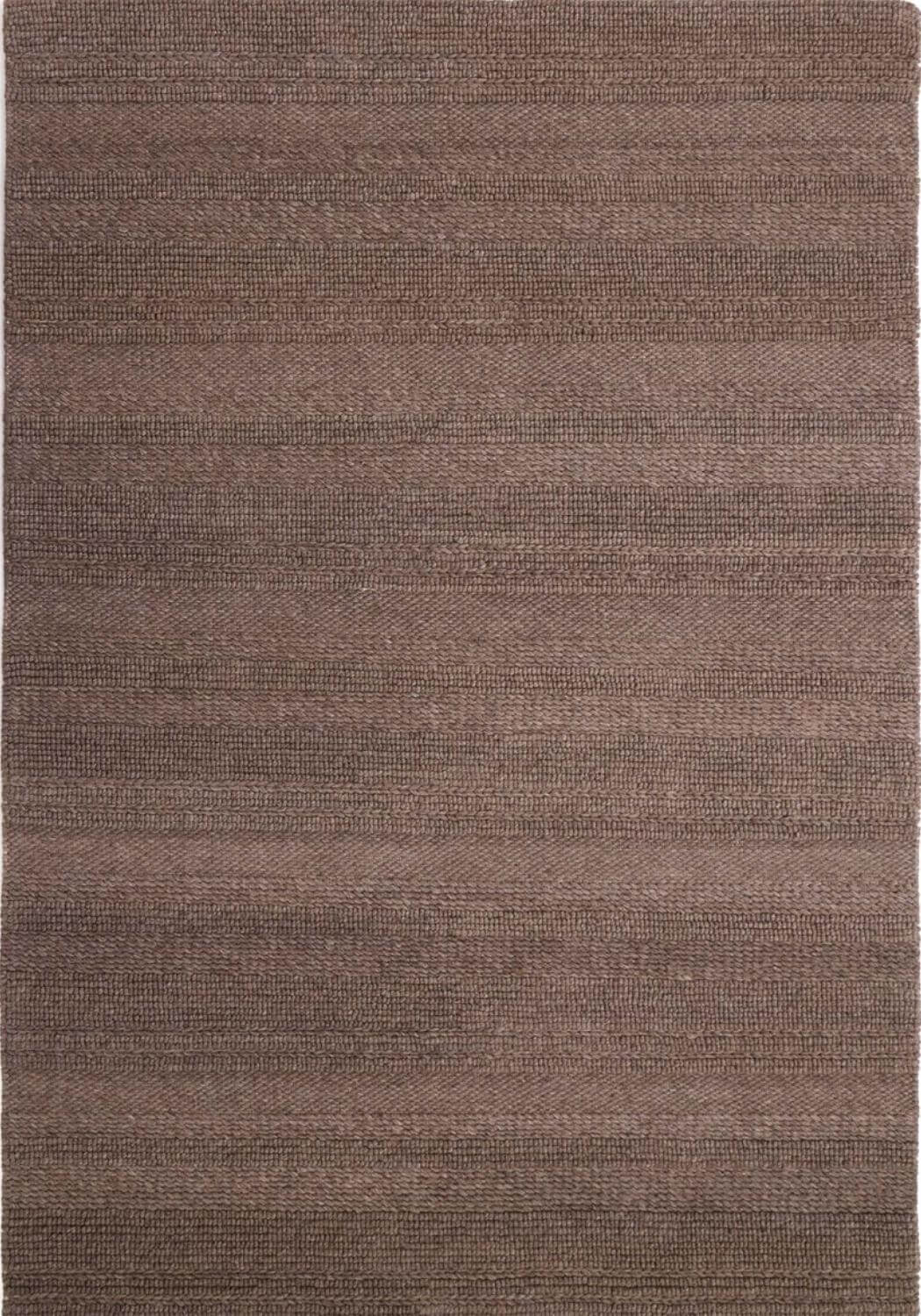 Brown textured rug with a subtle pattern