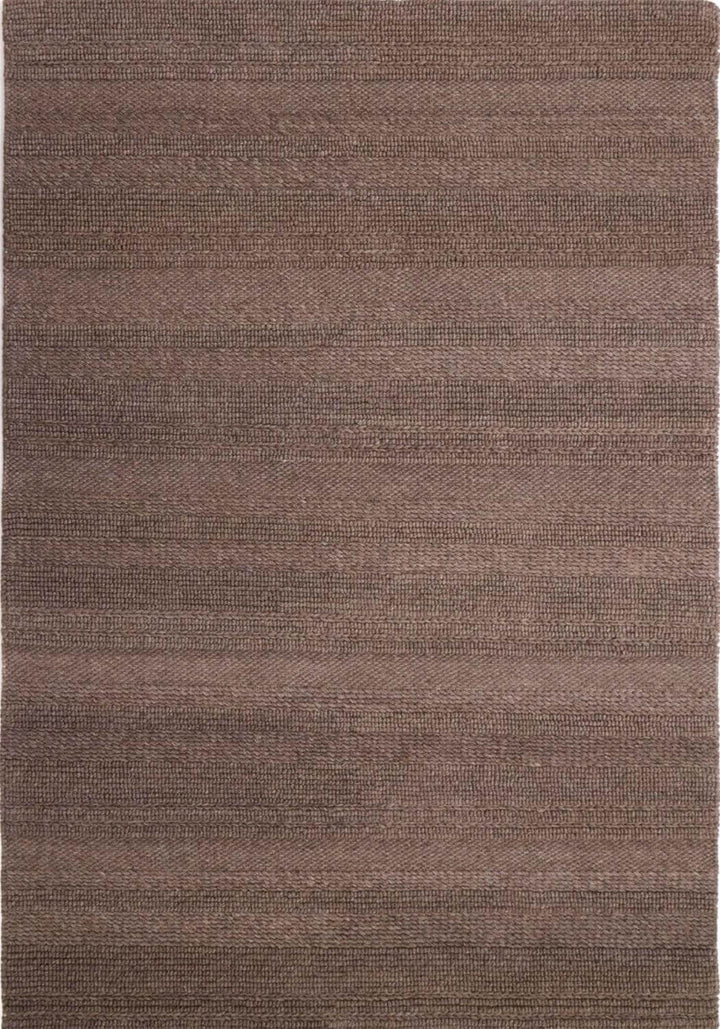 Brown textured rug with a subtle pattern
