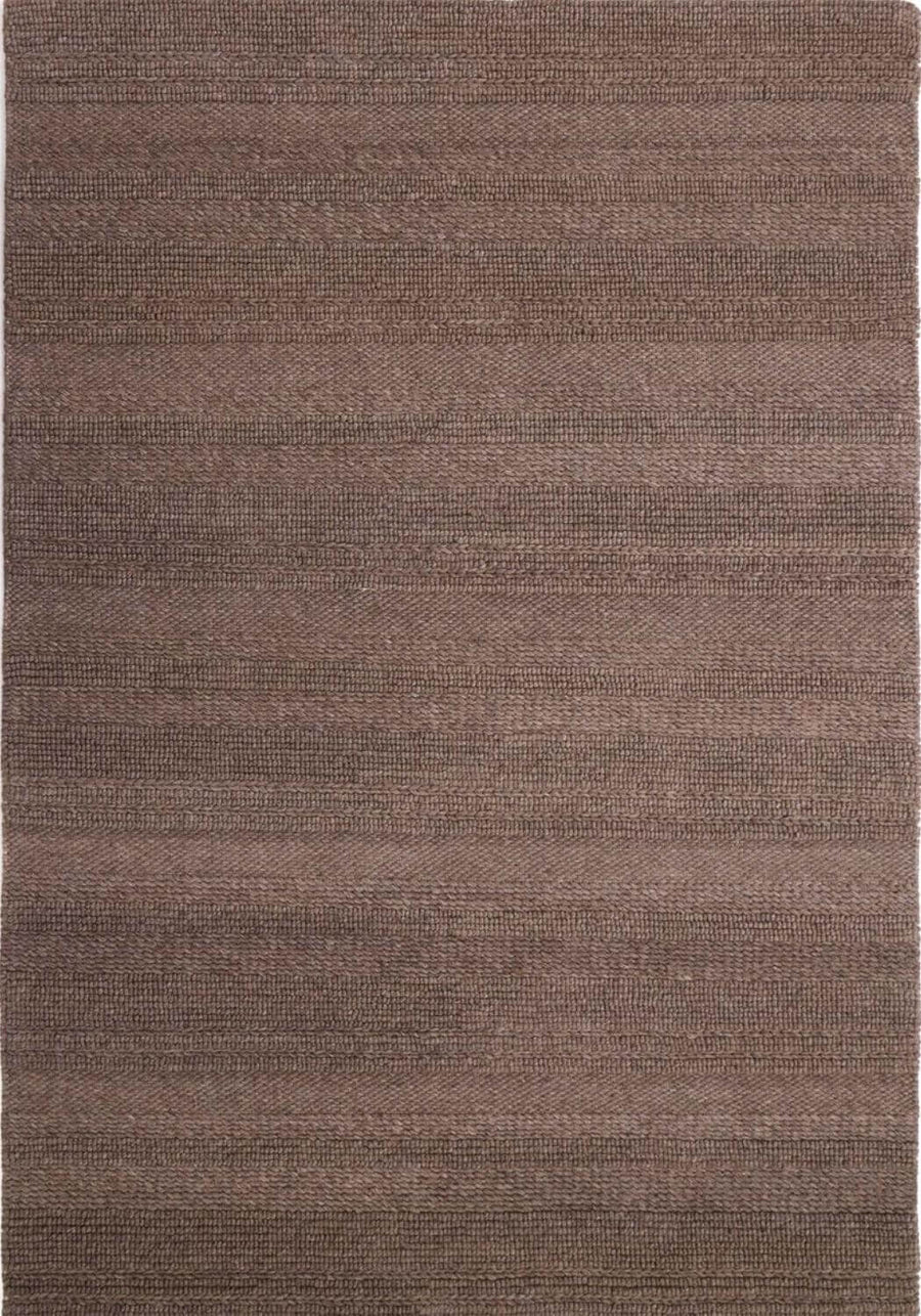 Brown textured rug with a subtle pattern