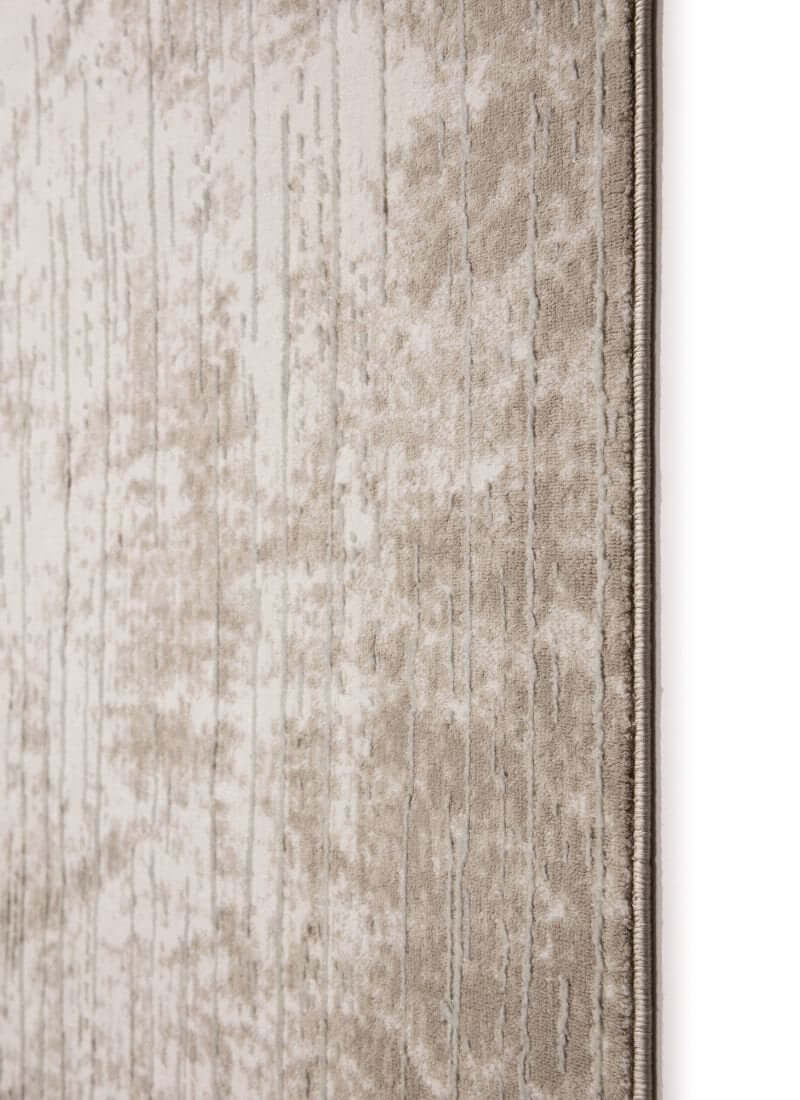 Abstract geometric rug in neutral tones of beige with a soft, textured surface for eco-conscious decor.