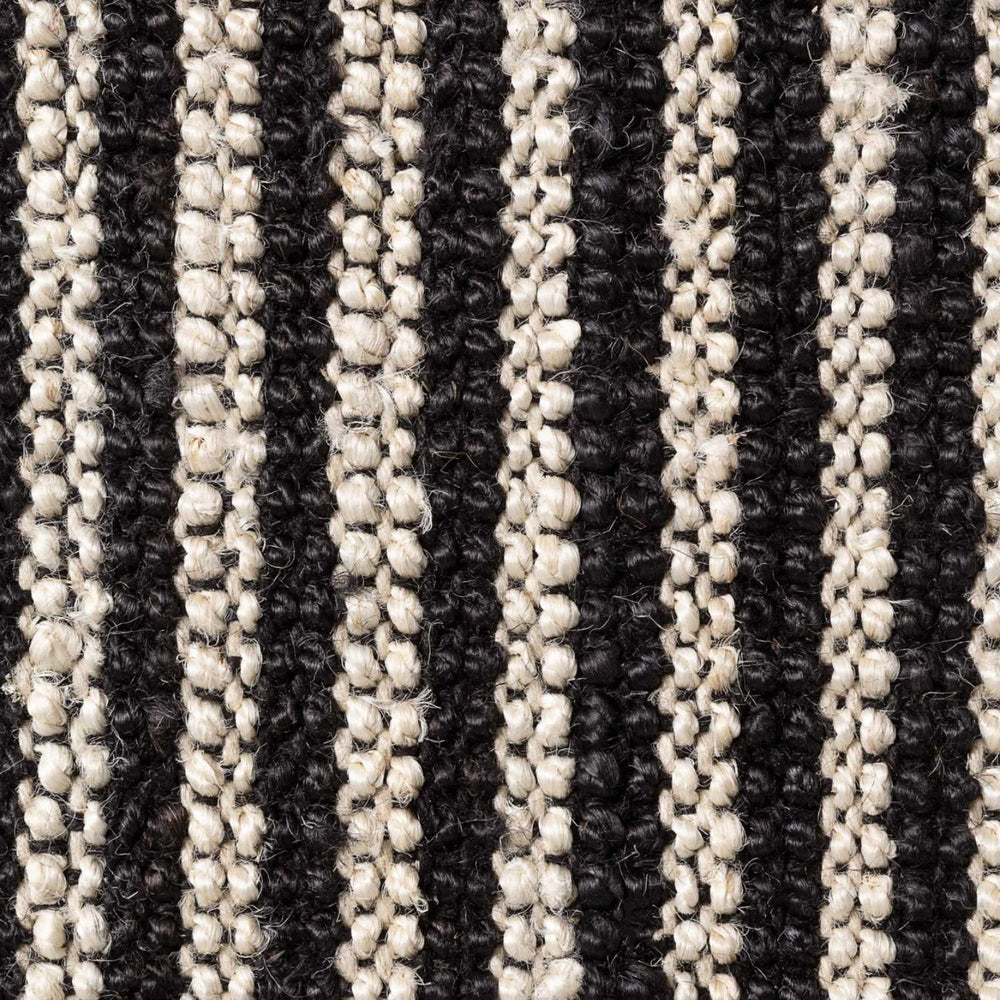 Close-up of a textured fabric with black and beige stripes
