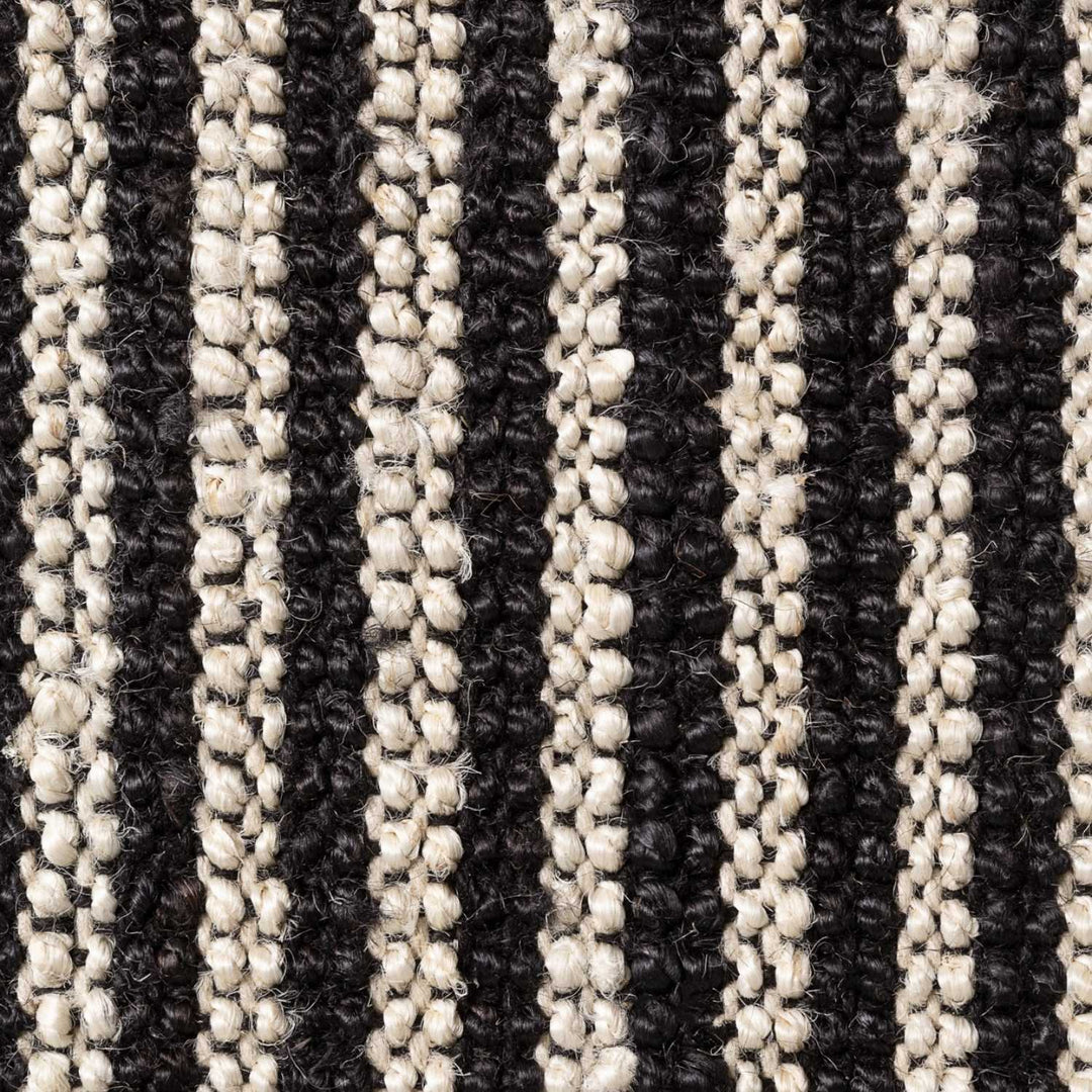 Close-up of a textured fabric with black and beige stripes
