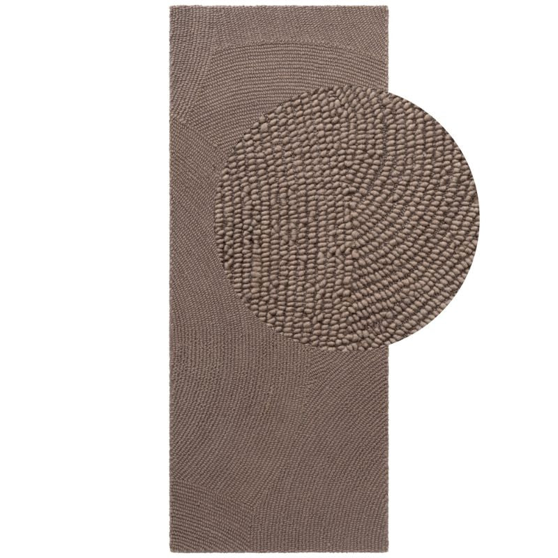 Brown textured rug with a circular pattern on a white background