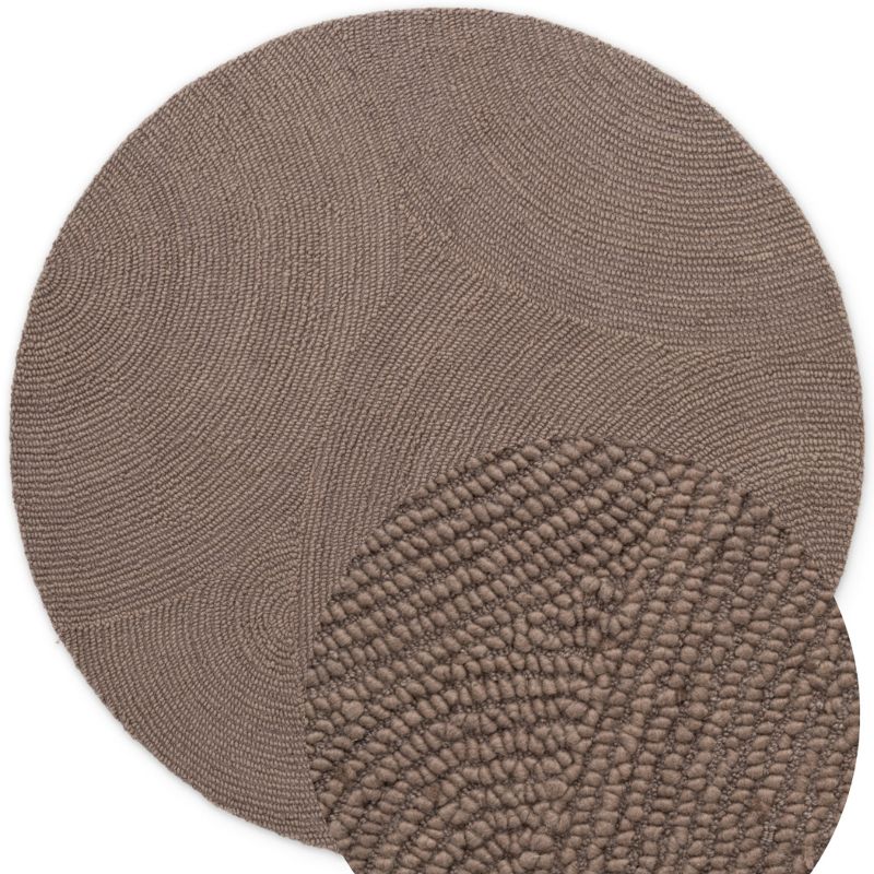 Round textured rug with a subtle pattern on a white background