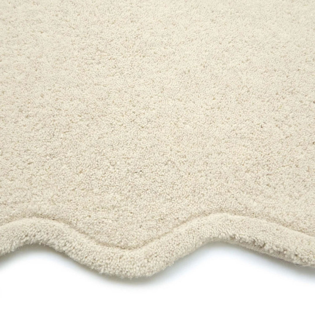 Close-up of a beige textured rug on a white background