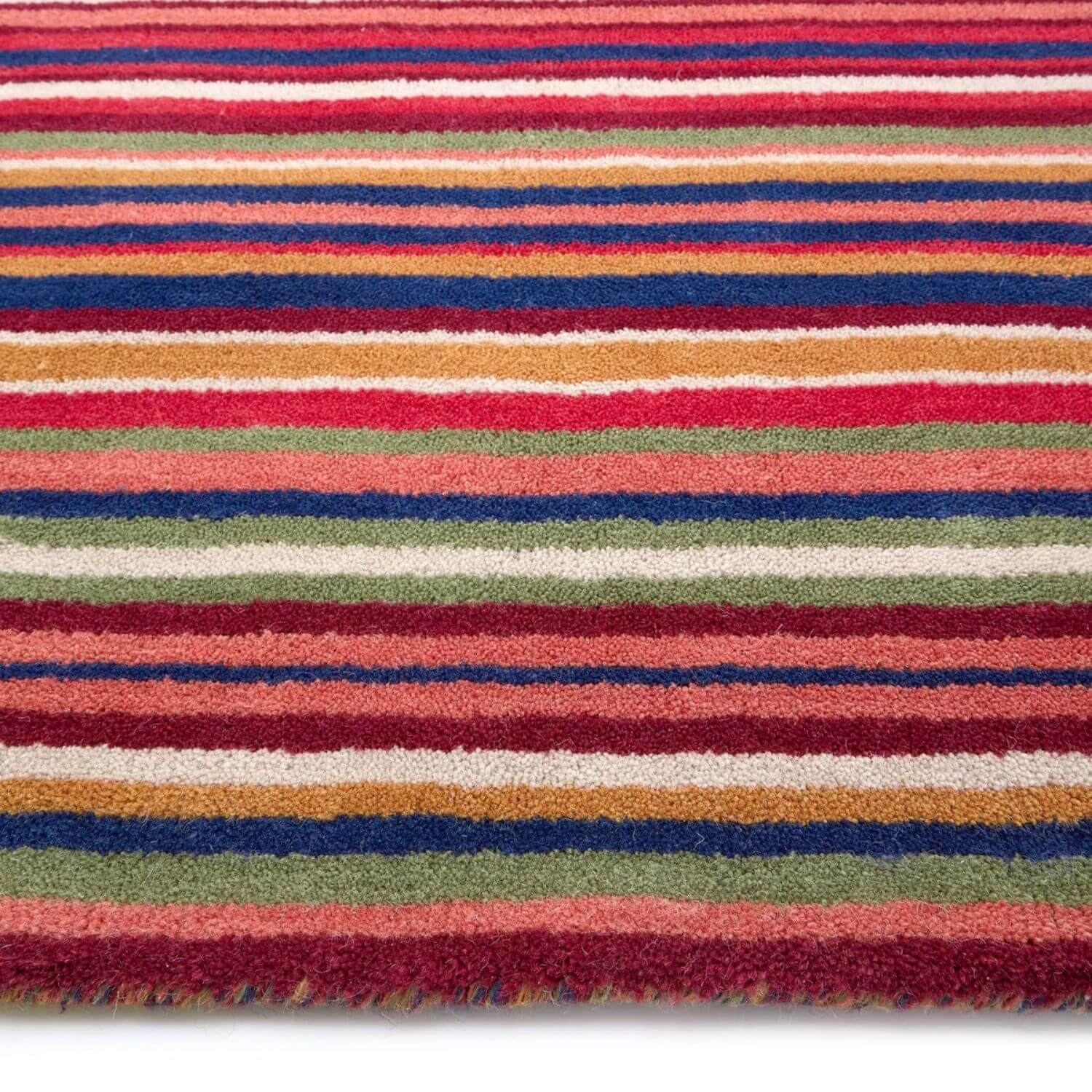 Multicolored striped rug with red, blue, green, and orange stripes on a white background