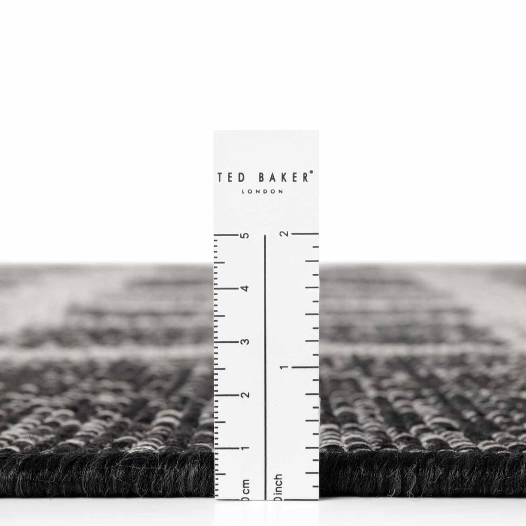 Rug with a ruler for scale, featuring the Ted Baker London brand.