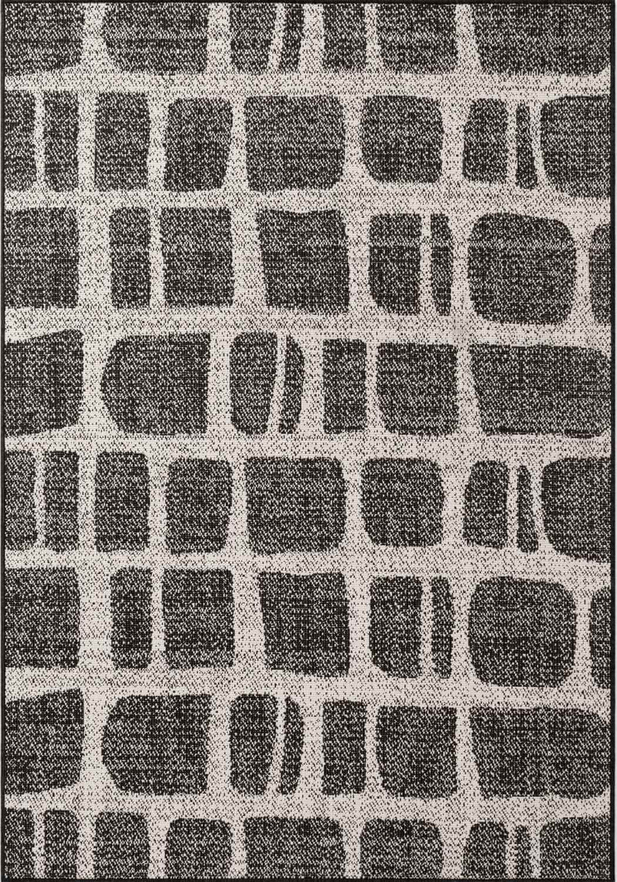 Patterned rug with black and gray geometric design