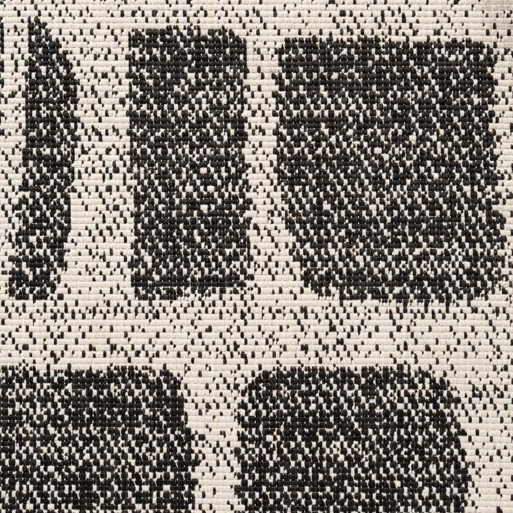 Close-up of a black and white checkered pattern fabric texture