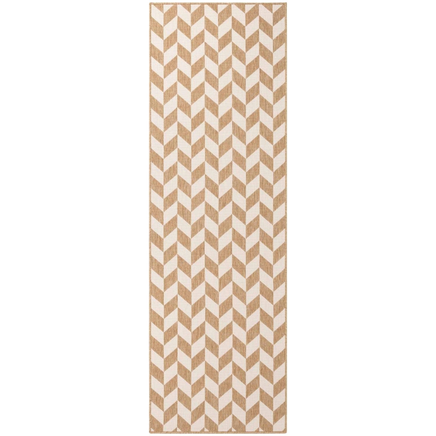 Beige and white chevron patterned rug on a white background