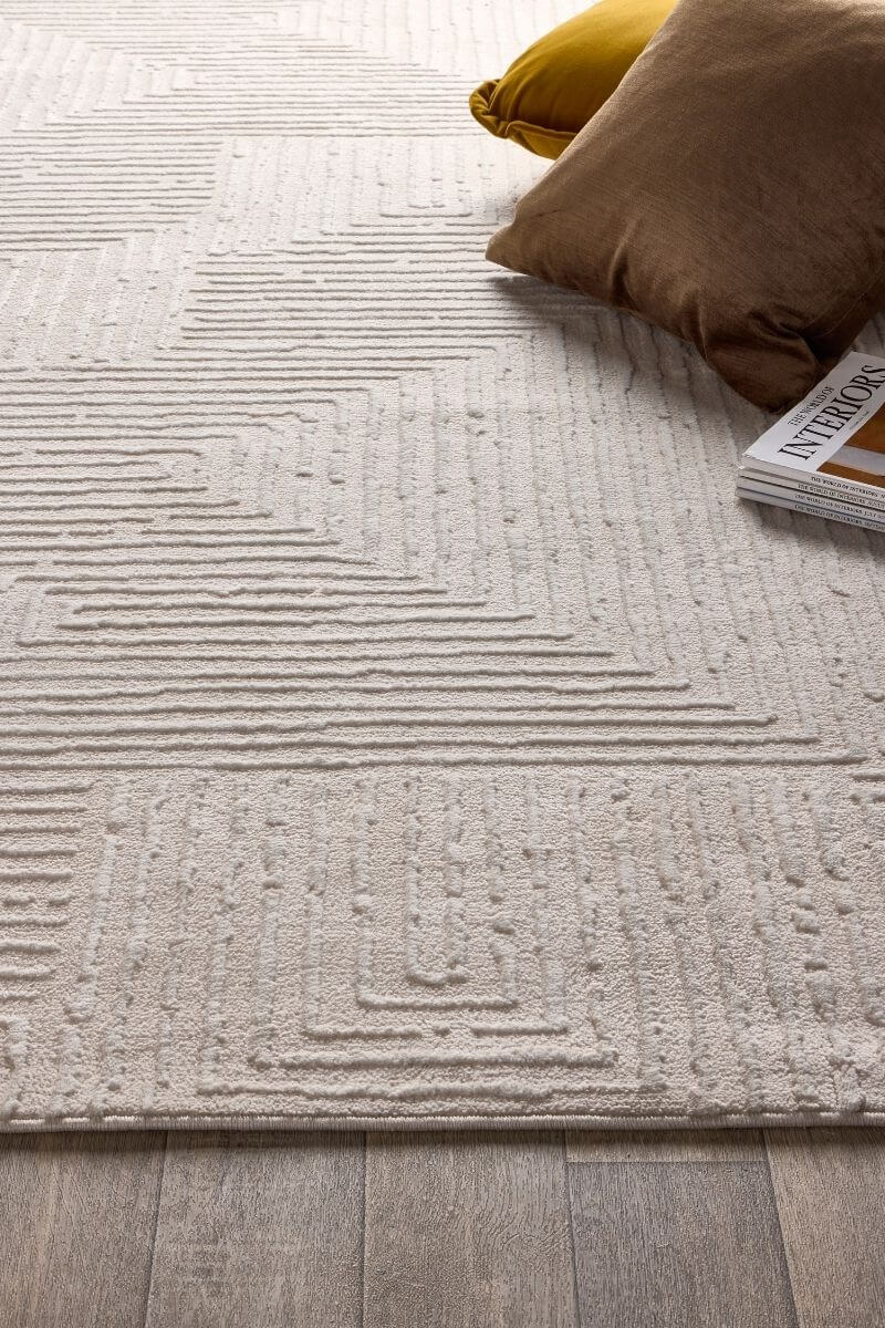 Abstract geometric rug in cream shades, featuring clean lines and soft texture, perfect for modern interiors.