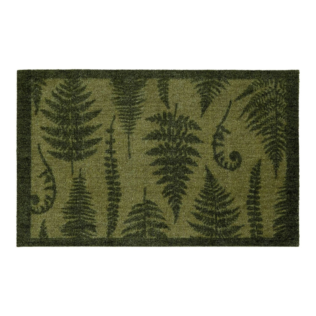 Fern patterned doormat on a white background