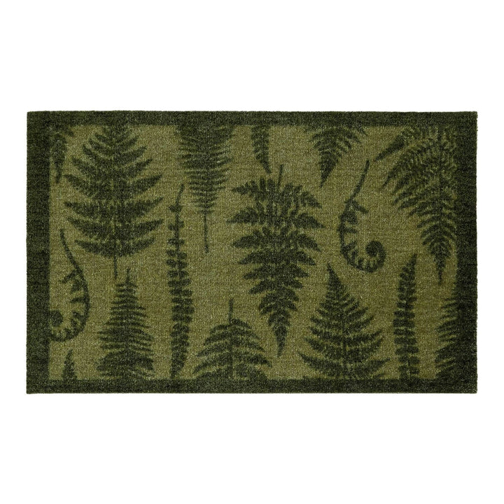 Fern patterned doormat on a white background