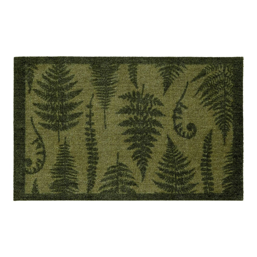 Fern patterned doormat on a white background