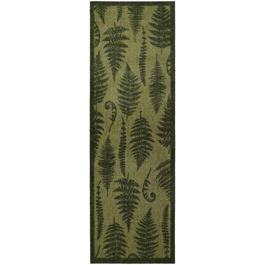 Green fern patterned rug on a white background