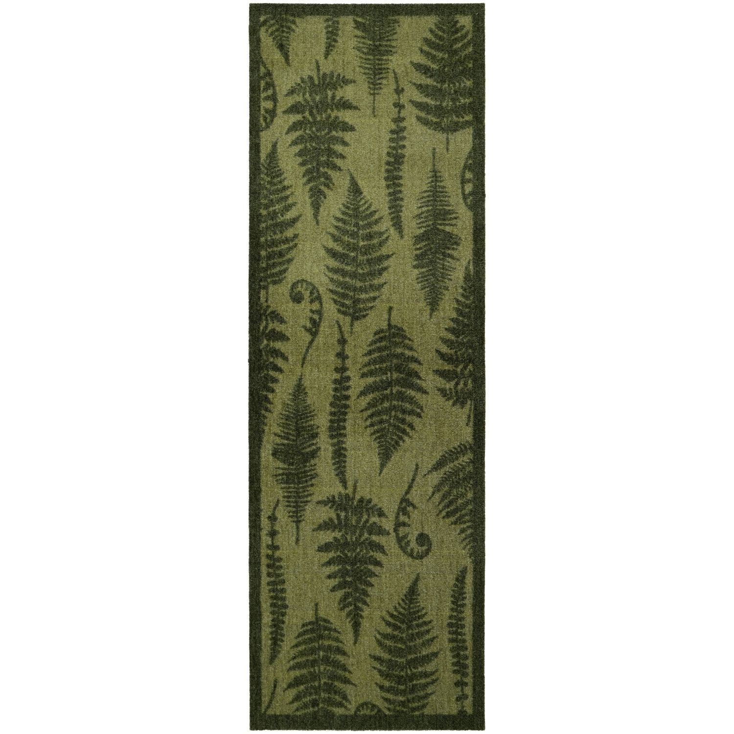 Green fern patterned rug on a white background
