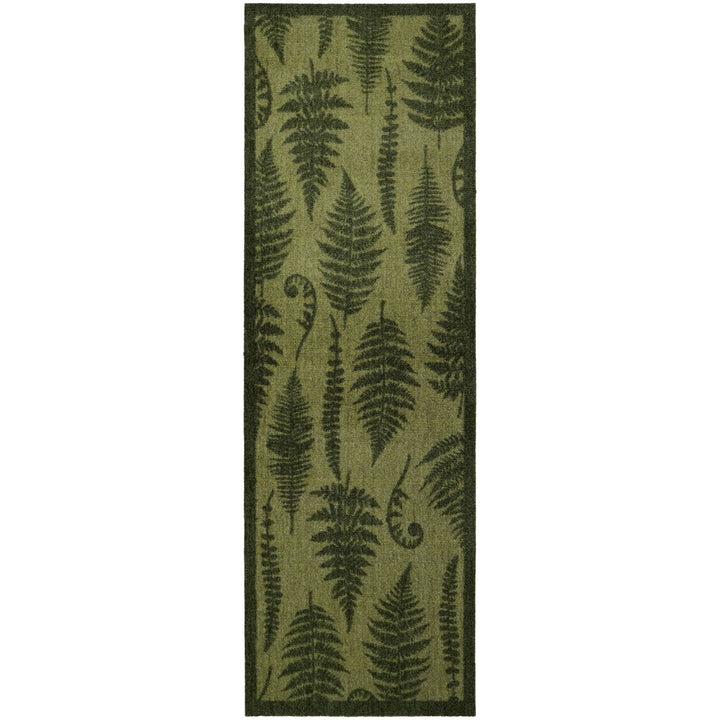 Green fern patterned rug on a white background